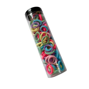 Colorful high elasticity hair bands for kids in a transparent cylindrical storage bucket
