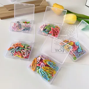 Polka dot and star candy colored mini BB hair clips in transparent storage box