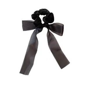 Elegant black bow hair scrunchie with long ribbons made of light sheer organza fabric