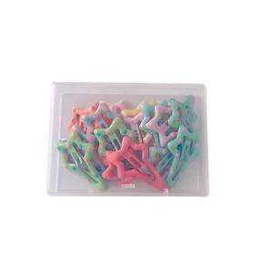 Set of star-shaped hair clips in macaron candy colors with polka dots in a clear box