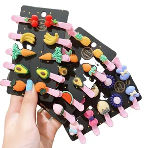 Cute cartoon hair clip set for kids featuring fruit and rabbit resin shapes on pink clips