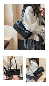 Λεπτομέρεια μαύρης τσάντας tote με vintage αγκράφα ζώνης και ασημί μεταλλικά στοιχεία