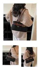 Detail of leopard print underarm bag with dark brown leather straps and gold buckle