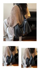 Detailaufnahme einer großen schwarzen Hobo-Tasche mit feiner Lederstruktur für den Alltag