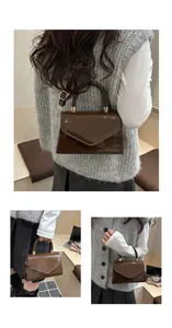 Gros plan sur la texture en cuir verni marron foncé et les ferrures dorées du petit sac
