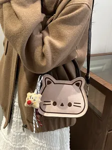Cute bread cat shaped handbag in beige with embroidered cat face and brown strap