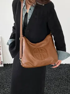Brown large capacity PU leather shoulder bag with vintage embossed geometric logo detail