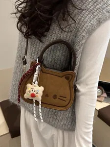 Cute bread cat crossbody bag in brown with adjustable strap and plush cookie charm