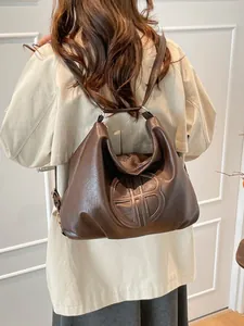 Vintage dark brown large hobo shoulder bag with embossed logo on soft PU leather