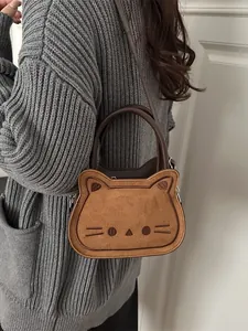 Cute brown cat-shaped crossbody handbag with embroidery and versatile shoulder strap
