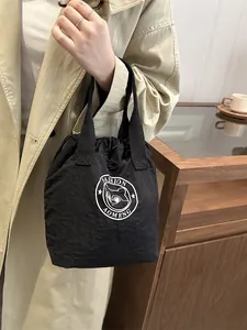 Waterproof nylon drawstring lunch bag with cat logo and top handles for daily commute