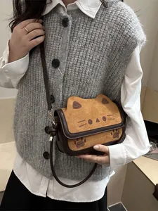 Cute cat-shaped crossbody bag in brown contrast faux suede with a stylish flap cover