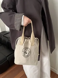 Fashionable beige waterproof drawstring lunch bag with retro cat logo for daily commute