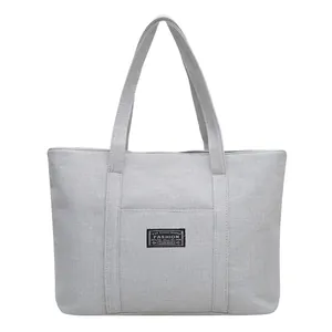 Borsa tote grigia in tela ad alta capacità con tasca frontale per pendolari e moda
