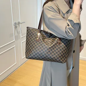 Brown monogram tote bag with gold bow clasp, stylish large capacity shoulder bag for women