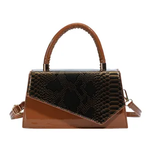 Brown patent leather square handbag with embossed snakeskin flap and adjustable strap