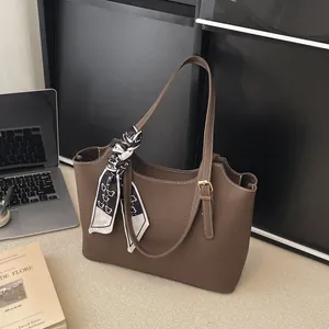 Brown litchi grain tote bag with decorative silk scarf handle for daily commute