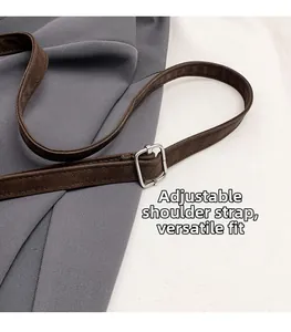 Detailed close-up of the adjustable dark brown matte leather strap with silver metal buckle
