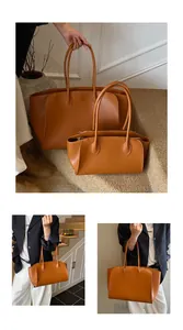 Vergleich der großen und kleinen karamellbraunen Ledertaschen im minimalistischen Design