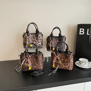 Retro leopard print faux suede tote bags in multiple colors with heart charms and straps