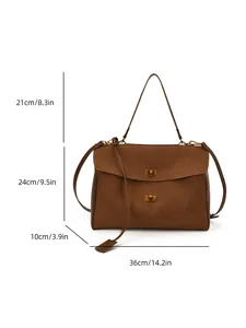 Detail view of brown suede shoulder bag with gold metal twist locks and dimensions