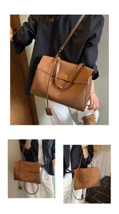 Detailed view of brown leather bag featuring golden buckle and premium texture