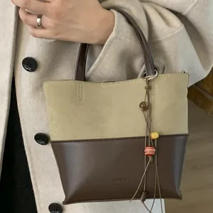 Vintage retro bucket bag with olive green suede and brown leather panels and beads
