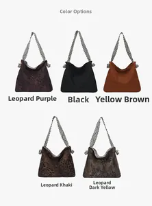 Detail view of large tote bags in leopard and solid colors with striped woven straps