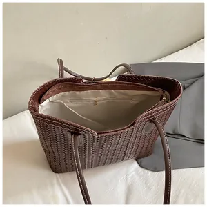 Detail view of woven coffee tote bag showing interior zip pocket and lining structure