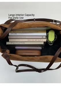 Top view showing the spacious interior of this brown suede tote bag with daily essentials