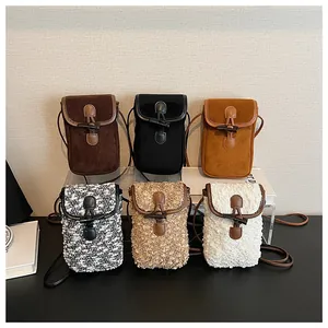 Detail showing various faux fur and suede mini crossbody bags with retro toggle buttons