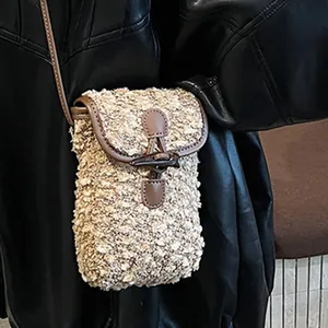 Fuzzy beige fleece crossbody bag with brown trim and toggle closure for autumn fashion