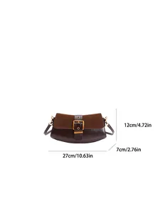 Detail showing the brown leather textures and gold buckle on a retro baguette bag