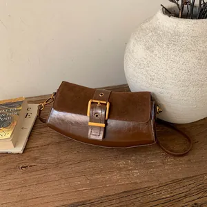 Vintage brown leather shoulder bag with a large gold buckle for women's daily fashion
