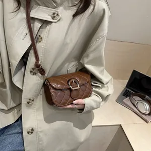 Brown quilted leather crossbody bag with flap and strap in a modern lifestyle setting