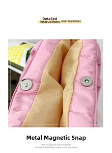 Close-up of the silver magnetic snap closure on a pink quilted puffer tote bag