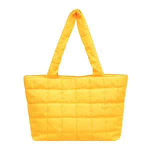 Quilted tote bag in bright yellow soft nylon with padded handles for winter fashion