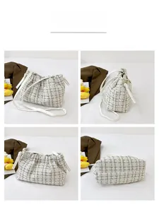 Detail views of cream tweed plaid bucket bag with adjustable faux leather strap
