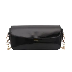 Chic black oil wax leather shoulder bag with golden chain strap and metallic clasp