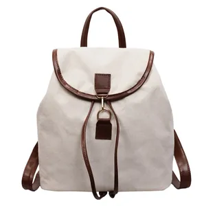 Vintage beige canvas rugzak met bruine lederen bies en trekkoord klepsluiting