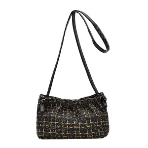 Retro black and gold tweed shoulder bag with pleated design and long shoulder strap