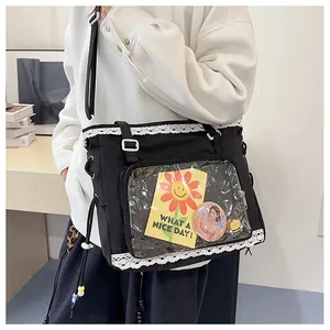 Close-up of black tote bag with lace trim, transparent PVC window and sunflower decor