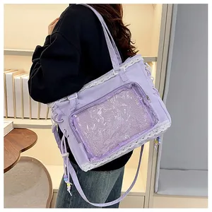 Side view of lavender canvas ita bag with lace edges and clear window for badges