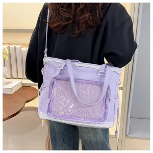 Detail view of purple tote bag featuring white lace trim and transparent front pocket