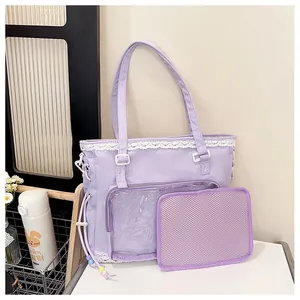 Detail of lavender nylon tote bag featuring white lace trim and a clear display pocket