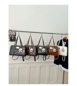 Detailed view of glossy PU leather tote bags in five colors with cute puppy charms