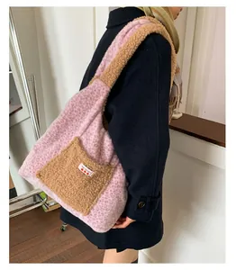 Detailed view of pink leopard faux fur tote bag with brown plush shoulder strap and patch