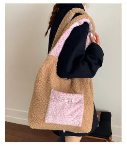 Detail of plush tote bag with brown faux fur, pink leopard pockets and strawberry label