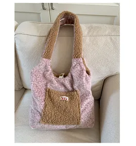 Detail of pink leopard plush tote showing soft faux fur texture and contrast pocket