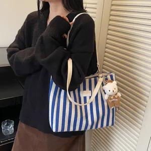 Striped canvas tote bag with leather straps and cute bear pendant for daily use